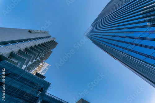 Facade of buildings in Austin Texas viewed from the street against blue sky