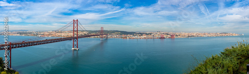 The 25 de Abril Bridge is a bridge, Lisbon Portugal. Panoramic view