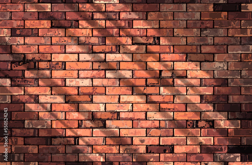 Brick wall made of red bricks. Vector illustration of a realistic brick wall in the bright rays of the sun. Sketch for creativity.