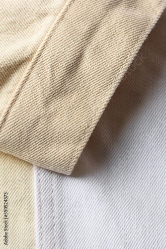 Denim fabric in color block white beige tone. Abstrac jeans textture