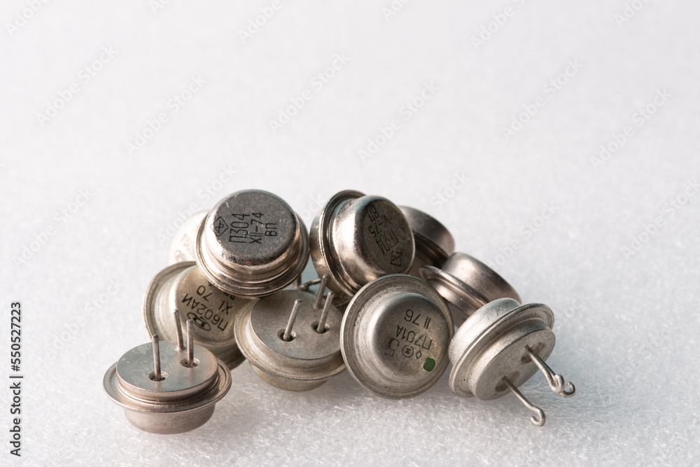 Obraz premium Old semiconductor transistors from Soviet technology on a white background