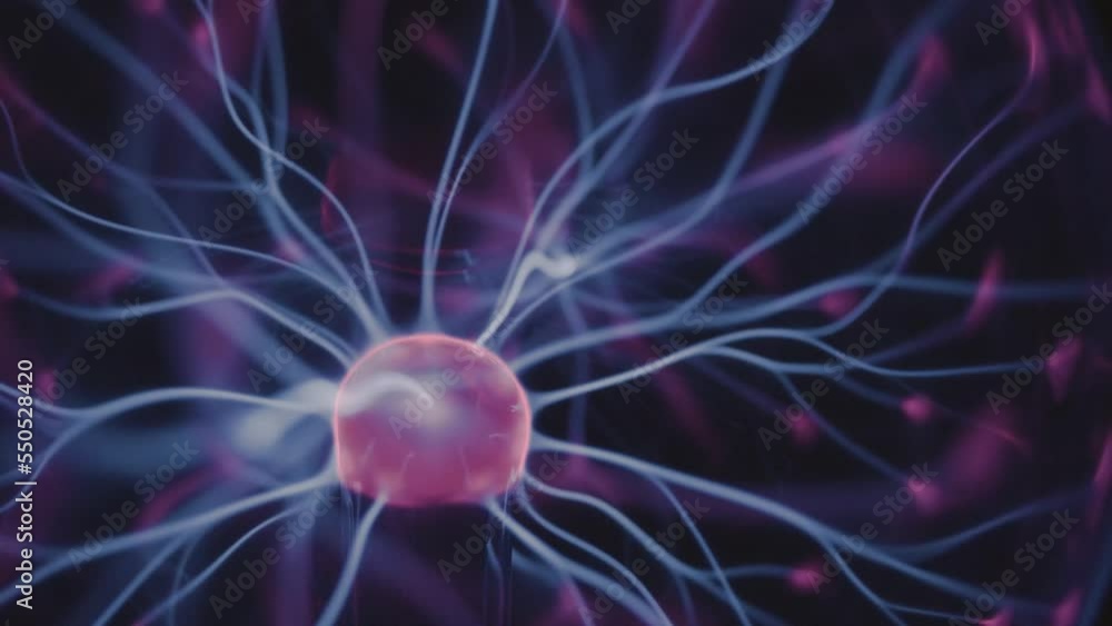 Plasma ball electric discharge in nitrogen helium gas mixture inside glass vacuum sphere closeup Plasma ball electric discharge in nitrogen helium gas mixture inside glass vacuum sphere closeup