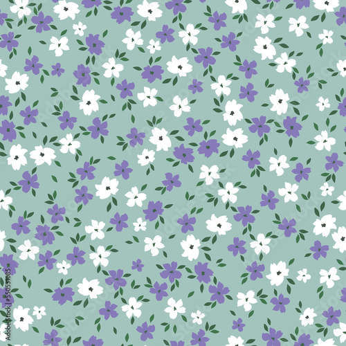 Cute floral pattern. Seamless vector texture. An elegant template for fashionable prints. Print with small white and lilac flowers .green background.