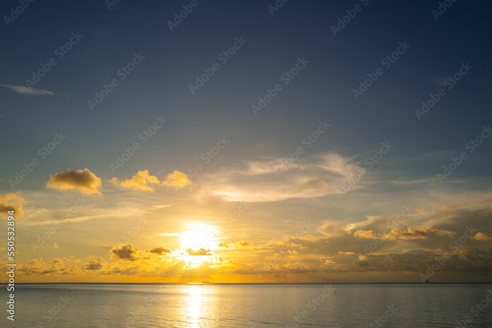 Sunset on sea background. Nature wallpaper with summer sea. Water sea texture. Calm sunrise on tropical sea. Calm ocean.