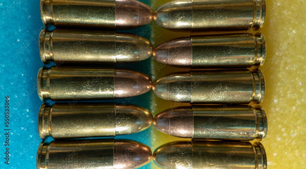 Fototapeta premium Bullets 9 mm, coat of arms and flag of Ukraine