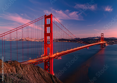 Golden Gate Bridge at night with car light trails