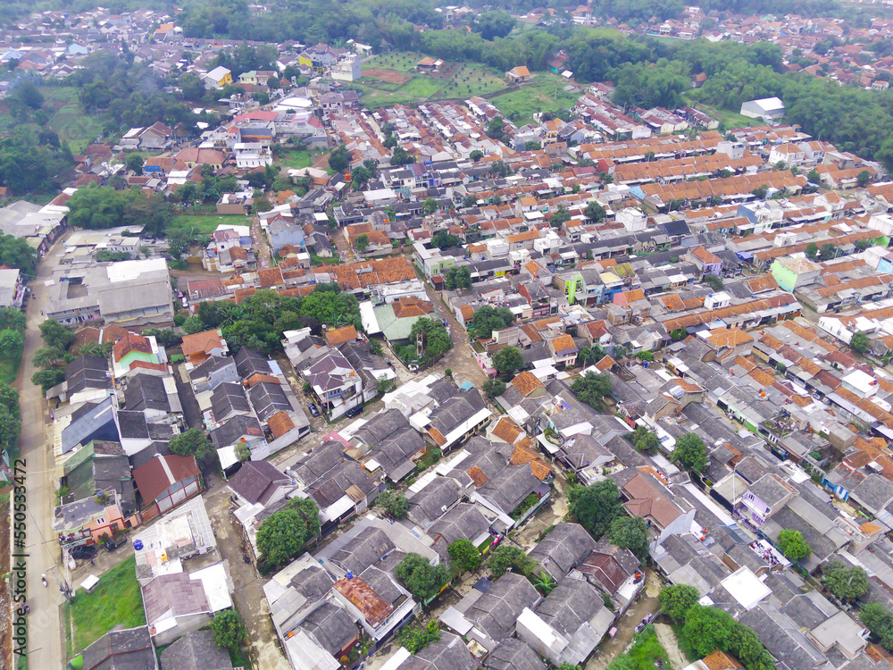Abstract Defocused Blurred Background aerial view of neatly arranged residents' houses in the Cikancung area - Indonesia. Not Focus
