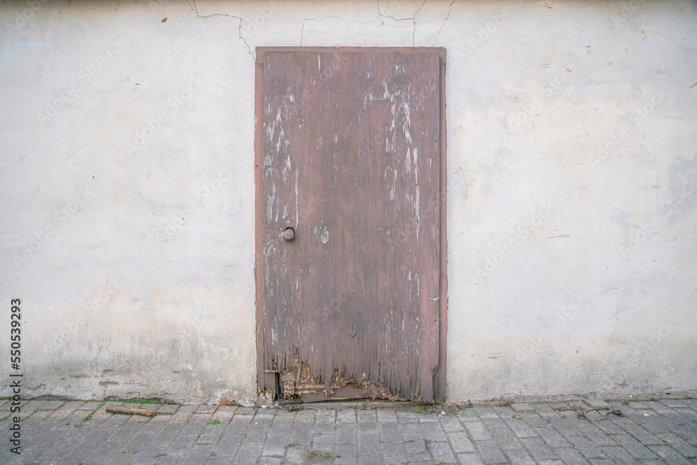 San Antonio, Texas- Weathered wooden door of an abandoned building San Antonio, Texas- Weathered wooden door of an abandoned building