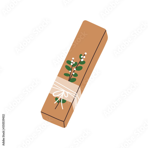 Kraft gift box, holiday cardboard package decorated with berries, leaf branch...