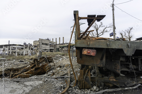 burnt cars and destroyed buildings of the workshop of the Azovstal plant in Mariupol