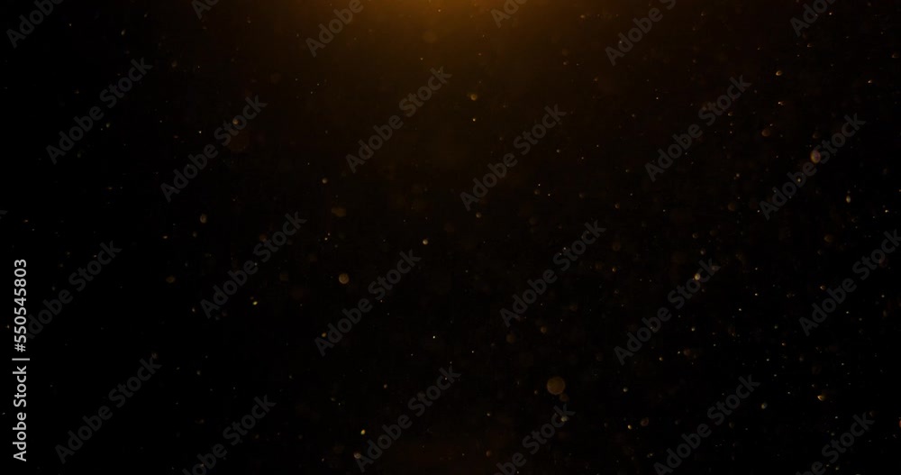 Dust particles floating in the air on black background. Slow motion shot, gold glitter shimmer Loop bokeh Dust particles floating in the air on black background. Slow motion shot, gold glitter shimmer Loop bokeh