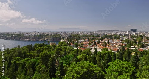 Antalya Turkey Aerial v74 cinematic low level flyover coastal karaalioglu park across neighborhoods capturing old cityscape of ancient city port harbor in summer - Shot with Mavic 3 Cine - July 2022 photo