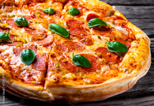 Pepperoni Pizza with cheese, salami, Tomato sauce, pepper, Spices