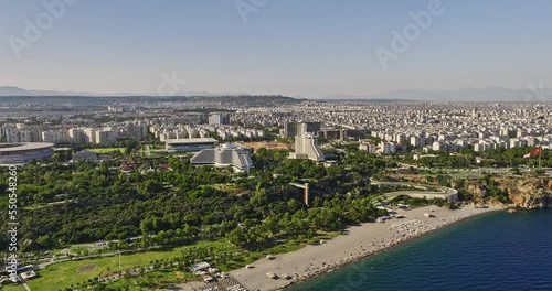 Antalya Turkey Aerial v7 cinematic drone flyover beautiful deep blue mediterranean sea capturing downtown cityscape and konyaalti beach with urban seaside park - Shot with Mavic 3 Cine - July 2022 photo