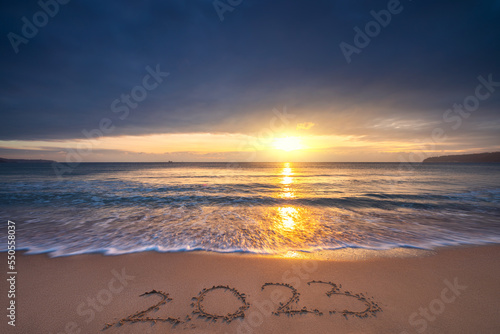 Fototapeta Naklejka Na Ścianę i Meble -  Happy New Year 2023 sea sunrise on the beach shore concept