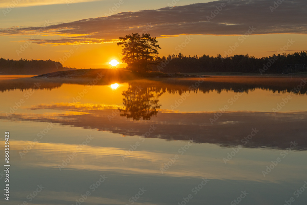 A beautiful sunset is reflected in the lake. Natural background.