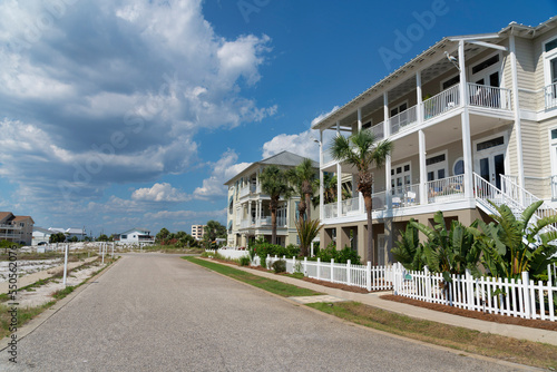 Destin, Florida- Street with concrete road at the front of three-storey houses with terrace
