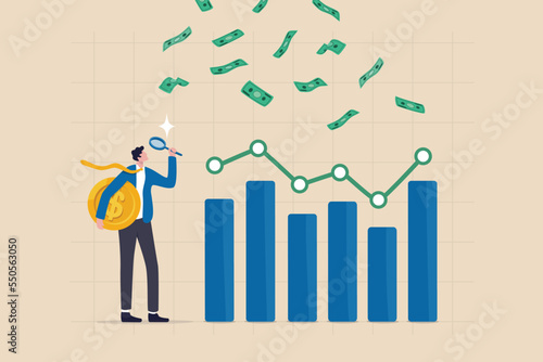 Financial market, investment earning or money management analysis, economic growth, stock exchange market report concept, businessman investor holding money coin analyze financial graph and chart.