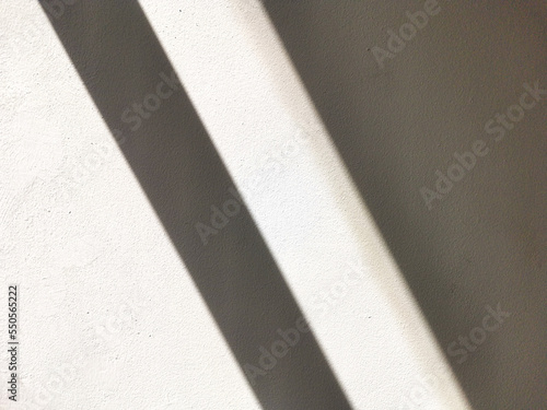 white blank concrete wall with shadow texture photo background
