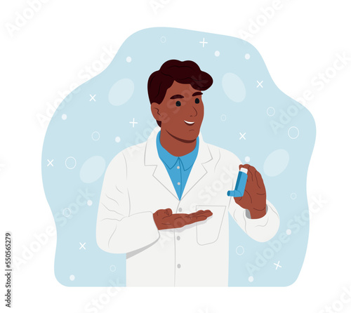 Childrens doctor. Young smiling black doctor holds an inhaler in his hands for inhalation. World Asthma Day. Bronchial asthma. Allergy, asthmatic. Inhalation drug. Bronchial asthma.