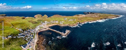 Aerial view of the settlement An Baile Thiar or West Town on Tory Island and harbour, County Donegal, Republic of Ireland photo
