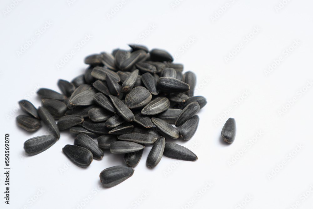 Heap of Sunflower Seeds on a white background. Heap of Sunflower Seeds on a white background.