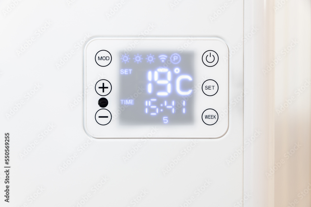 Close up of the display of an electric heater which is set at a maximum of 19 degrees in order to save energy. Close up of the display of an electric heater which is set at a maximum of 19 degrees in order to save energy.