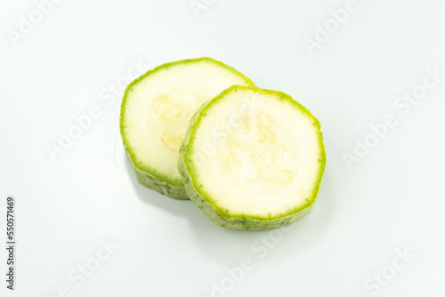 sliced fresh green cucumber isolated on a white background