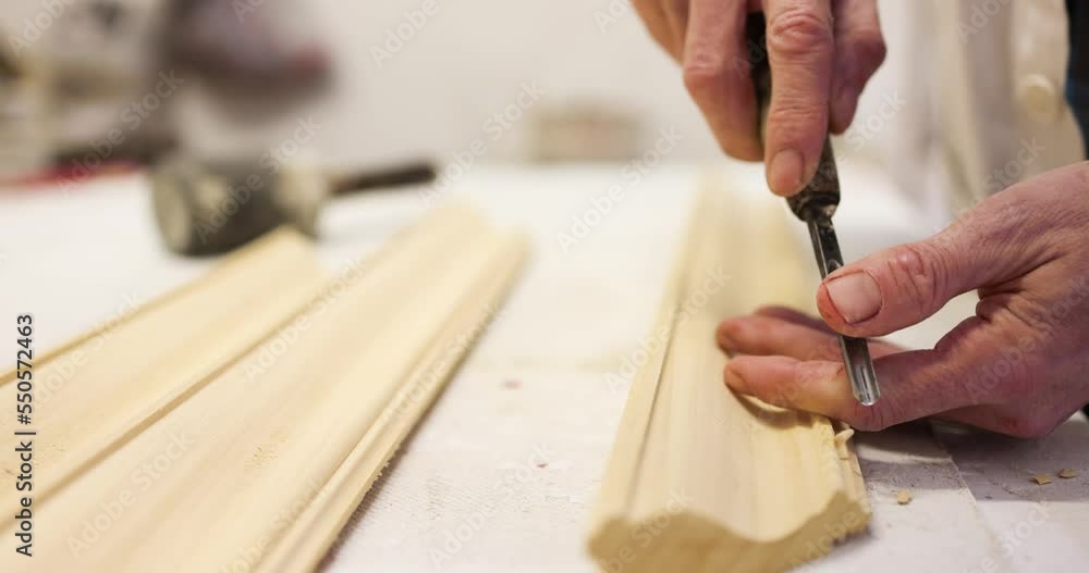 Hands of frame maker carving wood frame Hands of frame maker carving wood frame