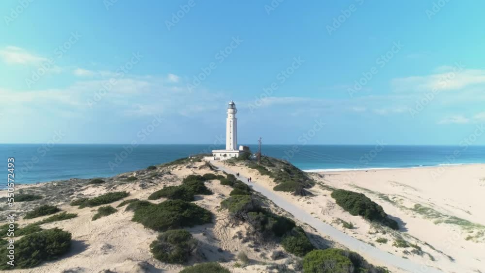 Aerial view over the dunes and over the Trafalgar lighthouse in Cadiz, Spain. Aerial view over the dunes and over the Trafalgar lighthouse in Cadiz, Spain.