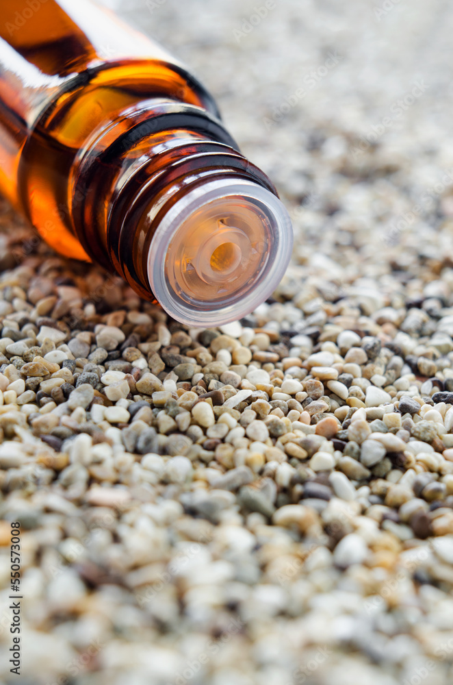 Small glass bottle with essential oil. Aromatherapy, sauna, homemade spa and herbal medicine ingredients. Copy space. Small glass bottle with essential oil. Aromatherapy, sauna, homemade spa and herbal medicine ingredients. Copy space.