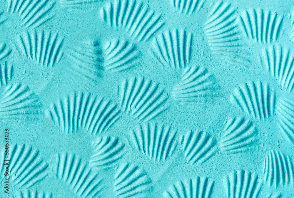 Aquamarine bentonite facial clay (alginate modeling mask, face cream, body wrap) texture close up, selective focus. Abstract turquoise background with seashell prints.