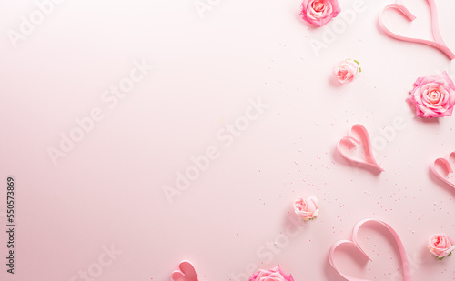 Happy valentine's day and love decoration background concept made from pink hearts and rose on pastel pink background.