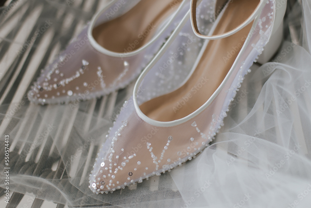 Beautiful detail close up white woman wedding shoes. Beautiful detail close up white woman wedding shoes.