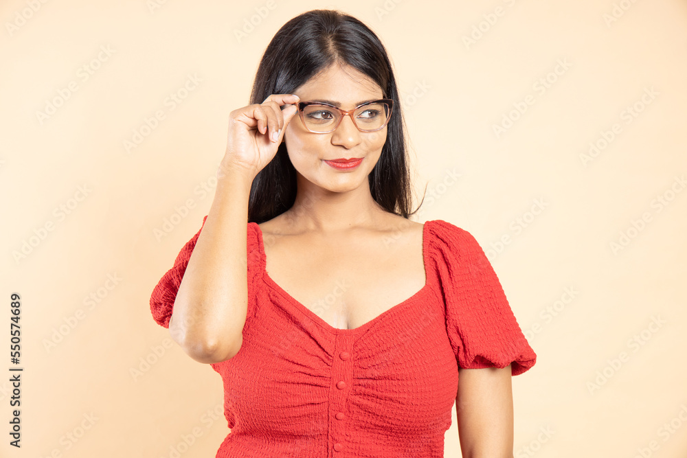 Beautiful brunette fashion indian model girl wearing spectacles. trendy eye wear portrait. Closeup, copy space Beautiful brunette fashion indian model girl wearing spectacles. trendy eye wear portrait. Closeup, copy space