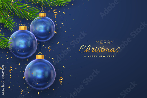 Merry christmas greeting card or banner. Hanging transparent glass balls, pine branches on blue background with golden falling confetti. New Year 3d design. Holiday Xmas baubles. Vector illustration