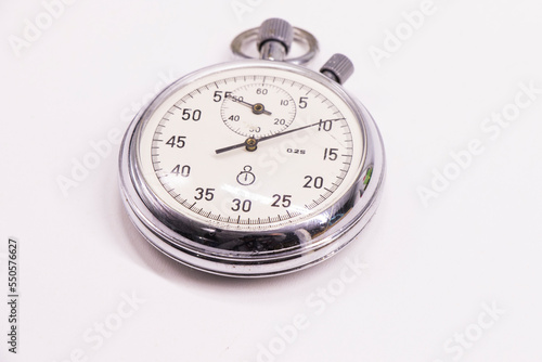 Old antiquary timer clock on the white background photo
