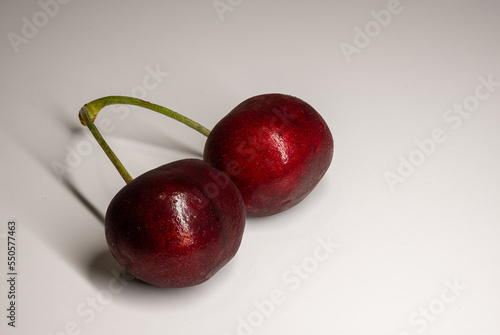 two cherries in white background