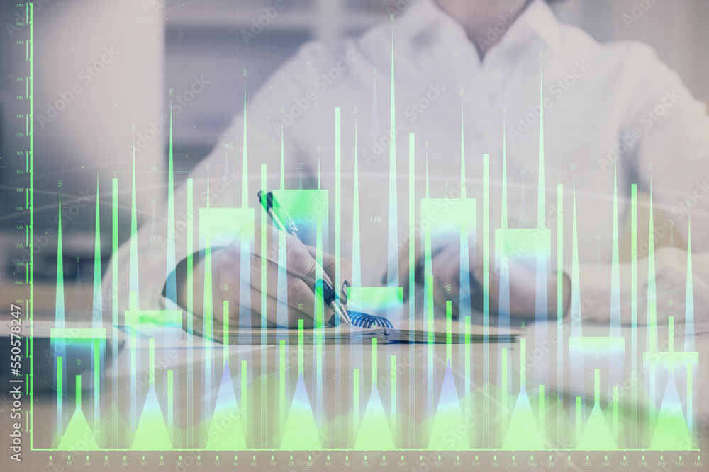 Financial chart drawn over hands taking notes background. Concept of research. Multi exposure Financial chart drawn over hands taking notes background. Concept of research. Multi exposure