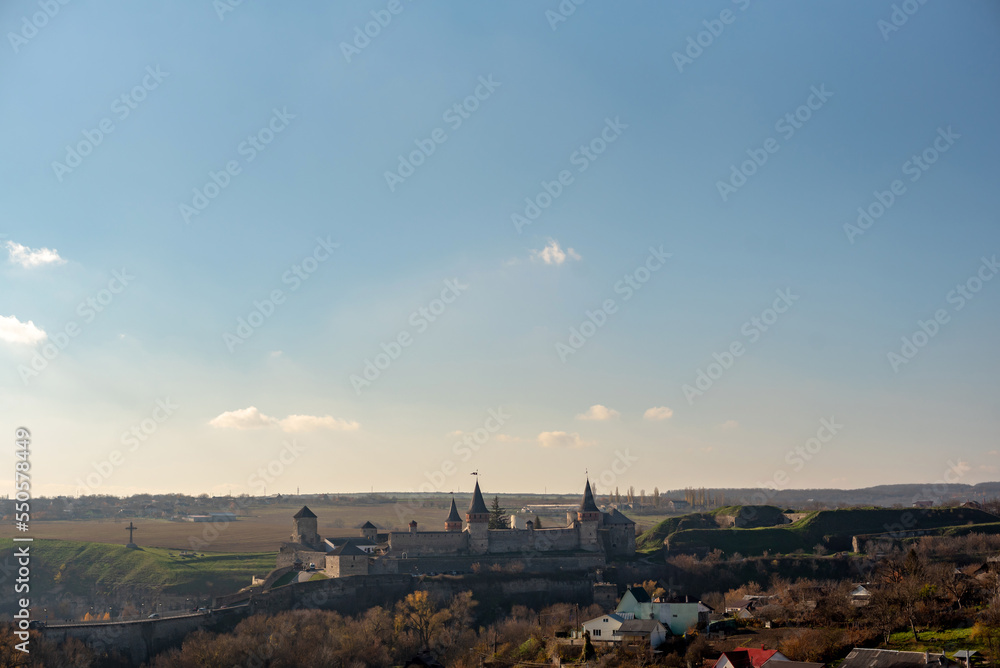 part of autumn
natural landscape with a view of space;
Kamianets-Podilskyi fortress — a fortress in the city of Kamianets-Podilskyi