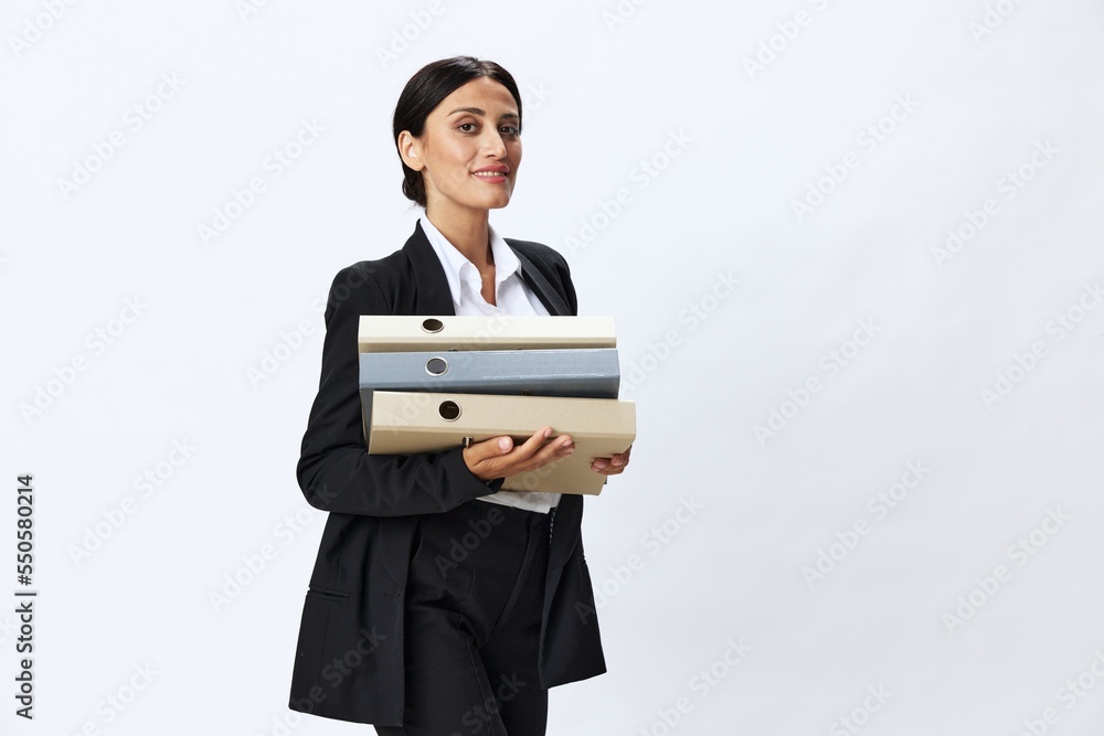 Business woman with a folder of documents in her hands in a black business suit and glasses shows signals gestures and emotions on a white background, work freelancer online training Business woman with a folder of documents in her hands in a black business suit and glasses shows signals gestures and emotions on a white background, work freelancer online training