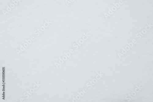 Snow texture background on winter cloudy day, top view