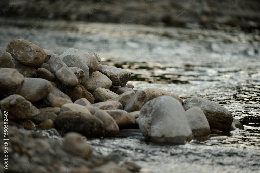 Coastal stones near the water, a place for copy space.
