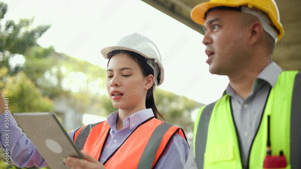 Male and Female Engineer or architect Using tablet for checking and maintenance to inspection in construction site. Two Supervisor engineers working at construction project. Civil engineering concept. Male and Female Engineer or architect Using tablet for checking and maintenance to inspection in construction site. Two Supervisor engineers working at construction project. Civil engineering concept.