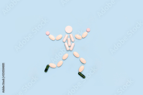 Healthy happy man made of pills. The concept of a timely health check