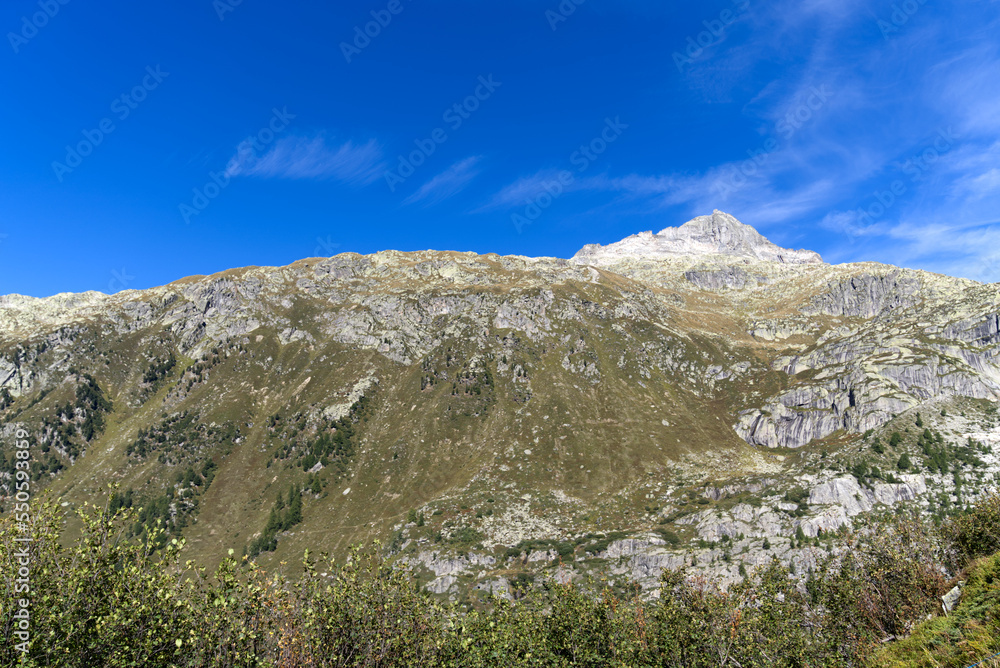 View of famous Rhone Glacier with Rhone River in the Swiss Alps with glacier river on a sunny late summer day. Photo taken September 12th, 2022, Furka Pass, Switzerland.