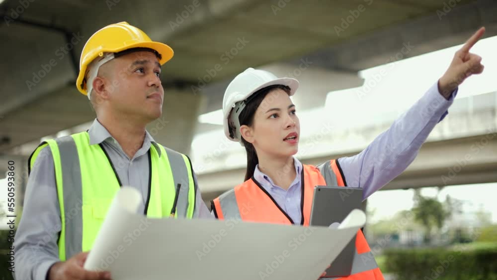 Male and Female Engineer or architect Using tablet for checking and maintenance to inspection in construction site. Two Supervisor engineers working at construction project. Civil engineering concept. Male and Female Engineer or architect Using tablet for checking and maintenance to inspection in construction site. Two Supervisor engineers working at construction project. Civil engineering concept.