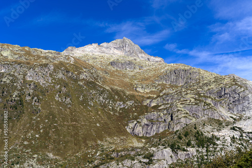 View of famous Rhone Glacier with Rhone River in the Swiss Alps with glacier river on a sunny late summer day. Photo taken September 12th, 2022, Furka Pass, Switzerland.