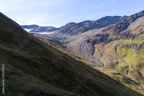 Scenic view of famous Swiss mountain pass Furkapass with rocks and mountain peak on a sunny late summer day. Photo taken September 12th, 2022, Furka Pass, Switzerland.