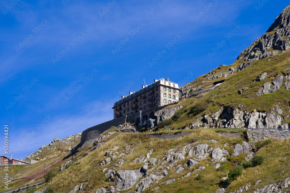 Scenic view of famous Swiss mountain pass Furkapass with serpentine road and Bélvedère Hotel on a sunny late summer day. Photo taken September 12th, 2022, Furka Pass, Switzerland. Scenic view of famous Swiss mountain pass Furkapass with serpentine road and Bélvedère Hotel on a sunny late summer day. Photo taken September 12th, 2022, Furka Pass, Switzerland.